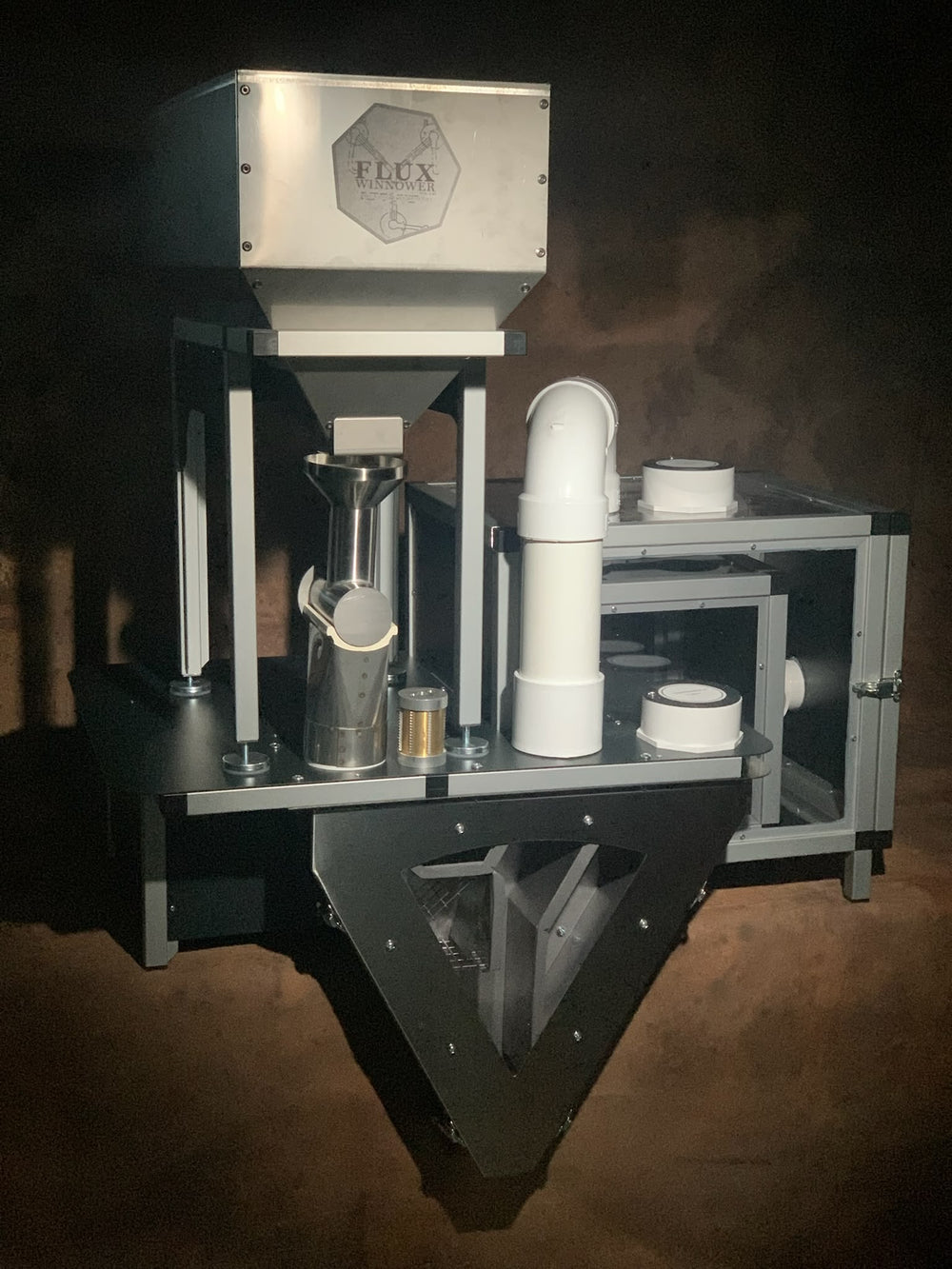 The Flux Winnower with hopper, separation chamber, and husk bin